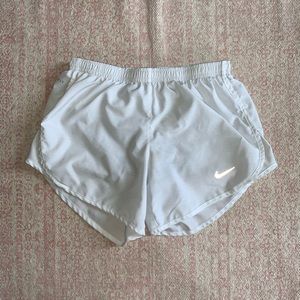 White Nike running shorts